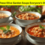 Top view of four signature Olive Garden Soups with breadsticks and salad on the side