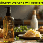Olive Oil Spray on a wooden table with pasta and salad in a 2025 modern kitchen setting.