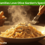 Creamy Olive Garden Chicken Alfredo with breadsticks and salad representing popular Olive Garden Deals for families.
